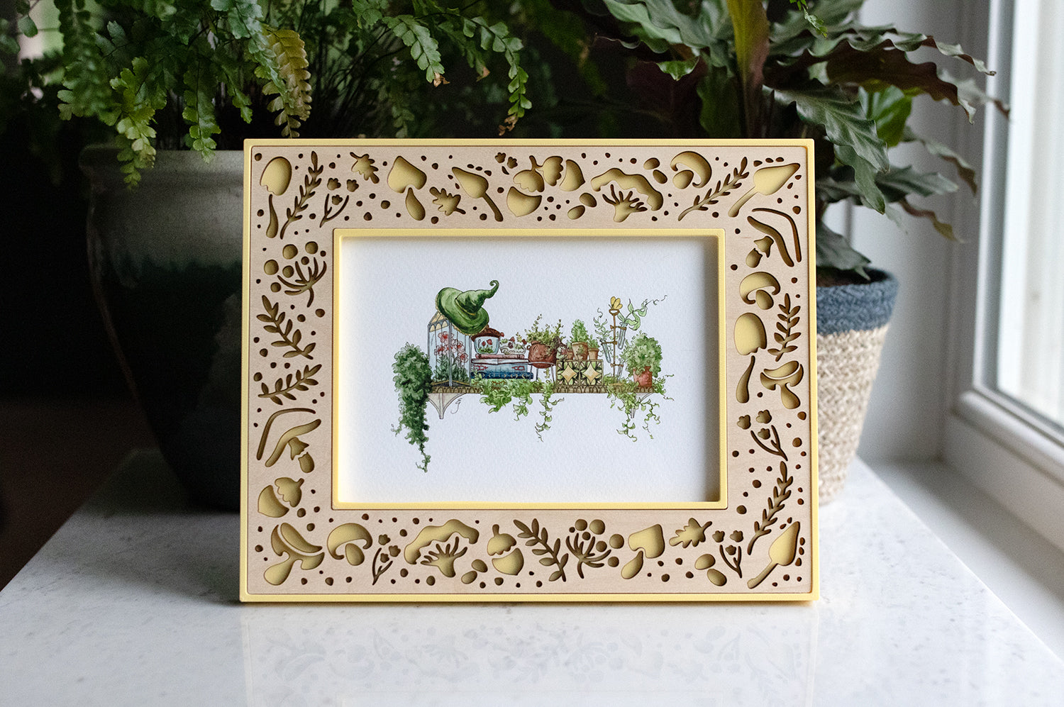 Large yellow 5x7 mushroom picture frame with delicate laser cut mushroom design. The handcrafted frame is yellow with a light maple wood inlay. 5x7 picture frame is displaying a picture of a garden witch's shelf.