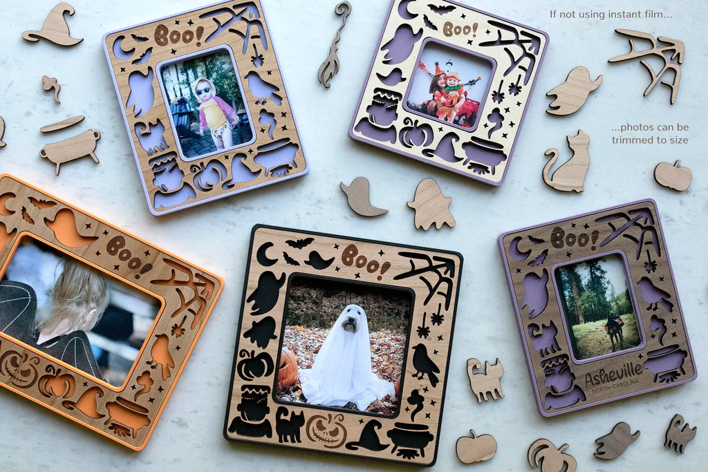 Magnetic Halloween picture frames with photos of kids in Halloween costumes and dogs dressed as ghosts. Frames feature Halloween pumpkins, ghosts, witch's hat, moon, and bats with an engraved "Boo!".