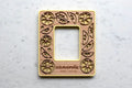 Personalized lemon picture frame for Instax Mini photos. Frame is yellow with a cherry wood inlay and the words "Weaverville North Carolina" engraved.