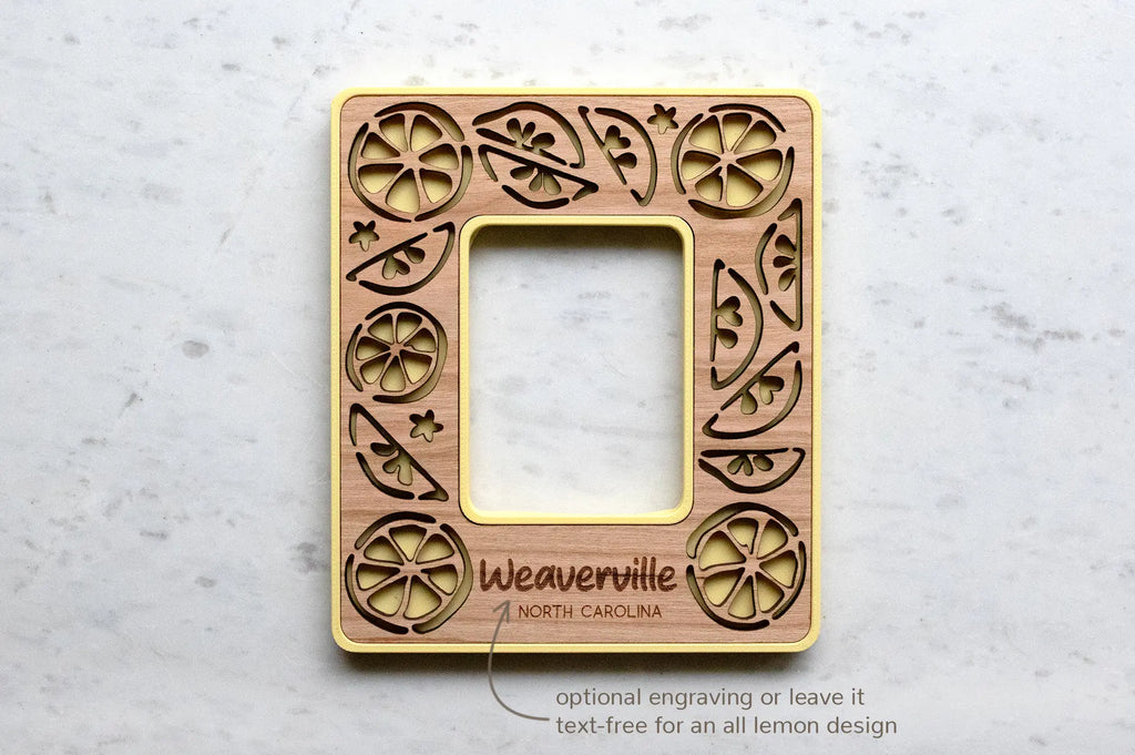 Lemon mini magnetic photo frame with optional engraved message on bottom. This frame reads "Weaverville North Carolina" in engraved text. Engraving is optional, and frames can be kept text-free for an all lemon design.