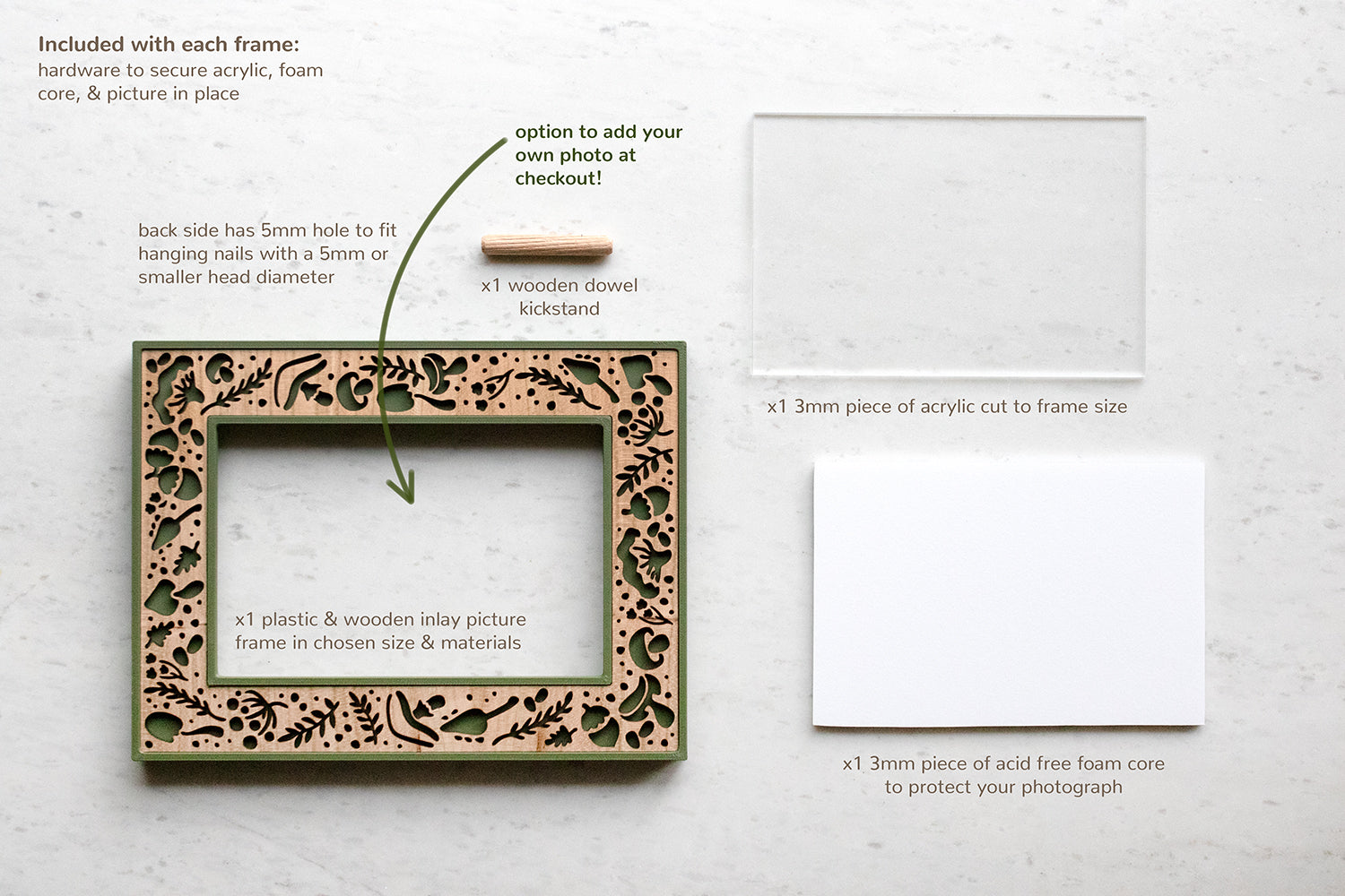 All picture frame contents include one wooden and 3D printed frame, one piece of high quality frame grade acrylic, acid free foam core, a wooden dowel kickstand, and hardware to secure your photo in the frame. Parts are laid flat on white surface. There is a note that reads: "option to add your own photo at checkout!"