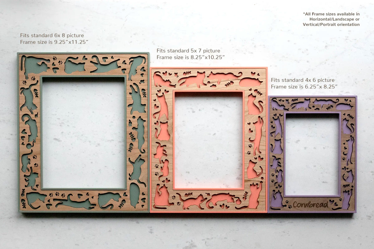 Size chart for the cat picture frames laid flat: a sage green 6x8 frame (9.25" x 11.25" overall), a coral 5x7 frame (8.25" x 10.25"), and a lilac purple 4x6 frame (6.25" x 8.25") engraved with "Cornbread." Every size comes in horizontal or vertical orientation.