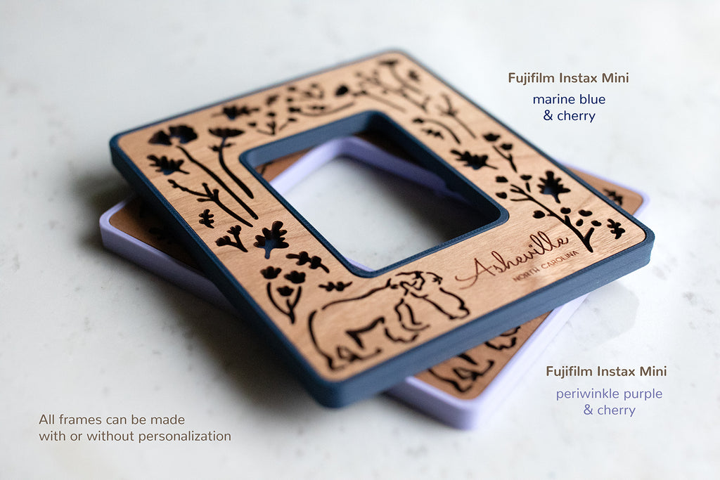 Two Instax Mini magnetic Polaroid photo frames stacked on top of each other. The bottom left corner of the image displays the words: "All frames can be made with or without personalization".