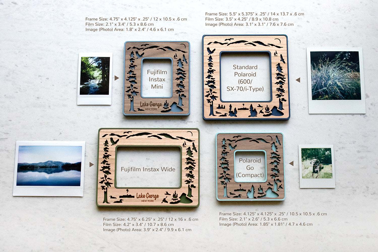 Two Polaroid photo frames and two Fujifilm Instax frames including Instax Mini and Instax Wide with a Lake George NY design. The frames are lying on a white marble surface next to their compatible photographs. The four available sizes include: Fujifilm Instax mini frame, Fujifilm Instax wide frame, Polaroid Go frame, and Standard Polaroid frame for 600 / SX-70 / i-Type Polaroid cameras. The image shows frame and photograph dimensions.