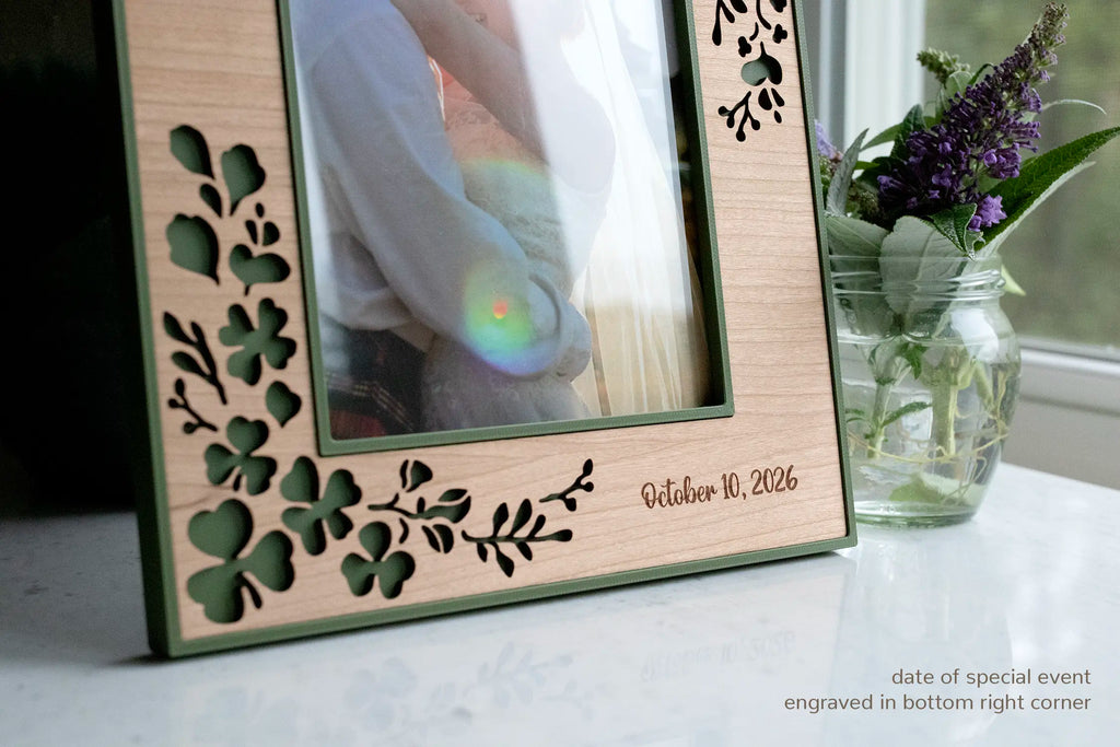 Personalized Irish wedding shamrock picture frame with laser-cut clover, wedding date "Oct 10 2026" engraved in the bottom-right corner. Image reads "date of special event engraved in bottom right corner."