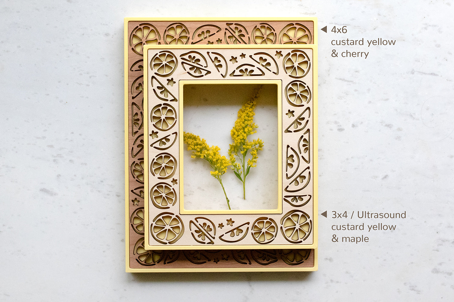 A 4x6 frame and a 3x4 frame with delicate lemon designs. The frames are bright yellow with cherry and maple wood inlays. The 3x4 frame fits sonogram and ultrasound photos for a cute lemon baby keepsake.