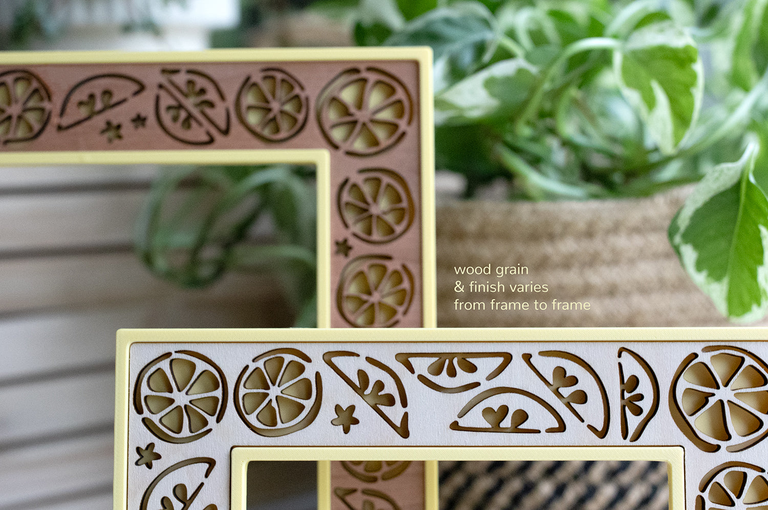 Two whimsical lemon picture frames. Frames are available in 4x6, 5x7, 3x4, and Instax Wide sizes. There is a note with the frames that reads "wood grain and finish varies from frame to frame".