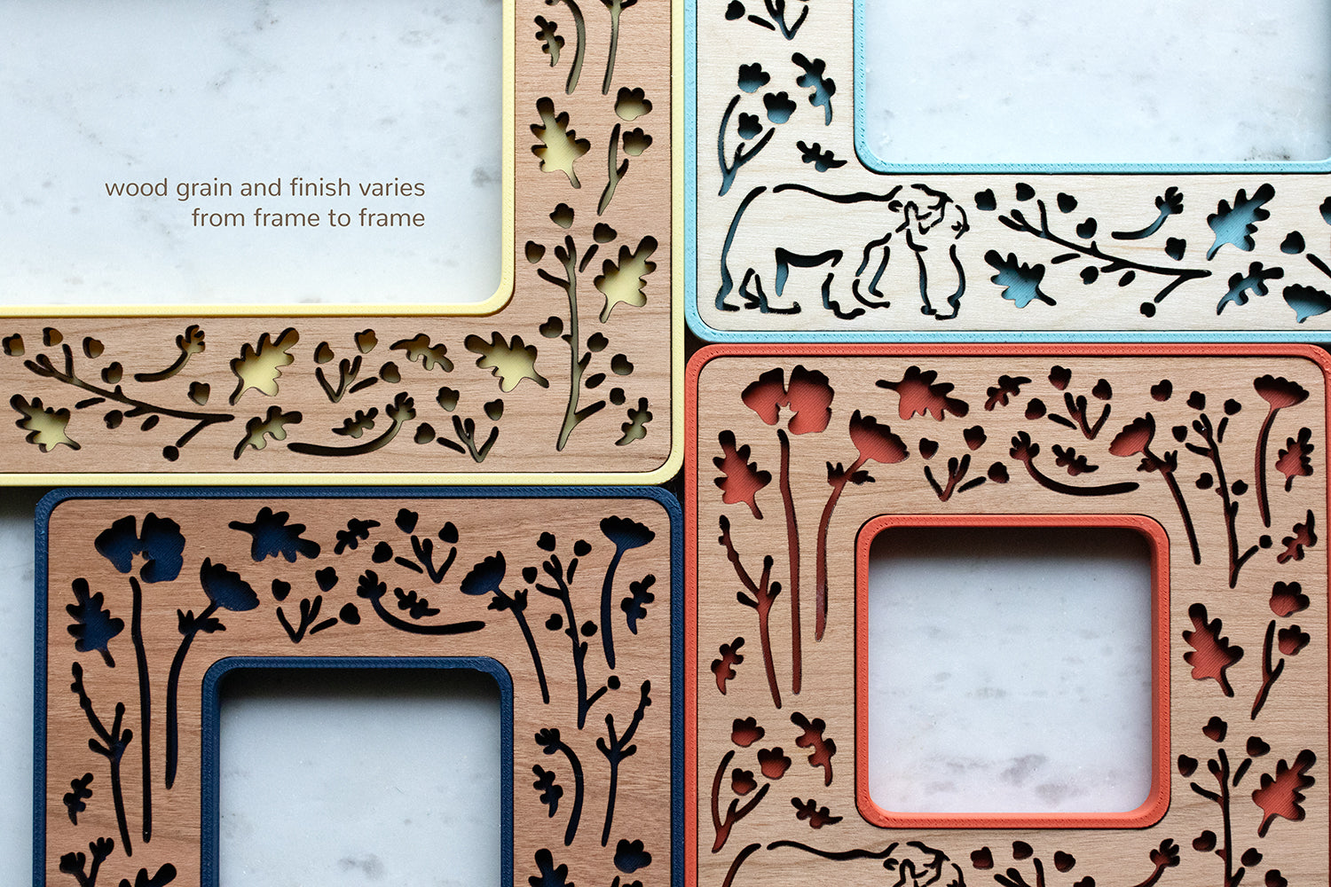 A close-up detail view of four magnetic Polaroid frames with mama and baby bear laser cut design. The message in the top-left corner of the image reads "wood grain and finish varies from frame to frame."