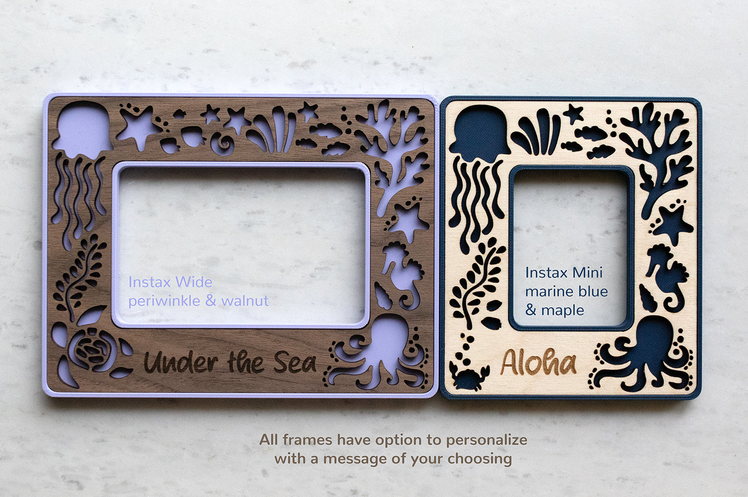 A navy blue Instax mini frame and a purple Instax wide frame. The frames are magnetic and have personalized messages including "Aloha" and "Under the Sea". There is note under the frames that reads: "All frames have option to personalize with a message of your choosing."