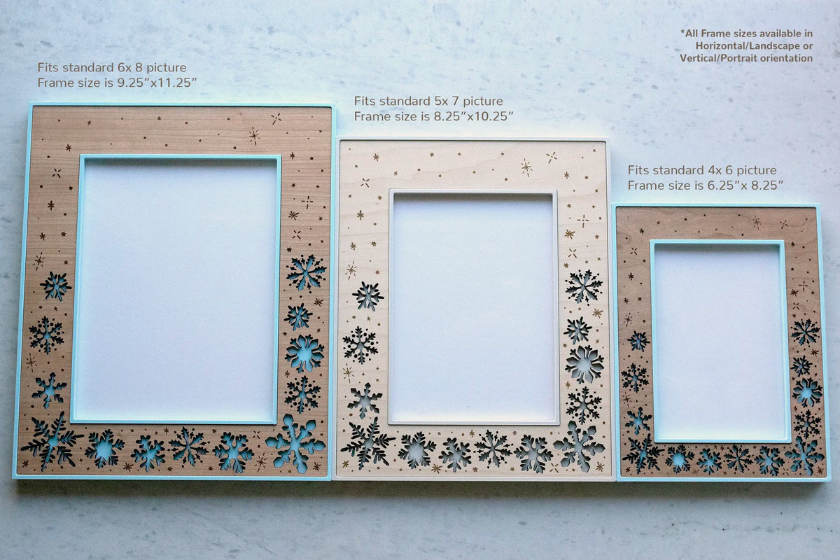 Size chart of the snowflake picture frame in three sizes: 6x8 photo (9.25" x 11.25" frame), 5x7 photo (8.25" x 10.25" frame), and 4x6 photo (6.25" x 8.25" frame), each with laser-cut snowflake and falling snow cutouts, available in landscape or portrait orientation.