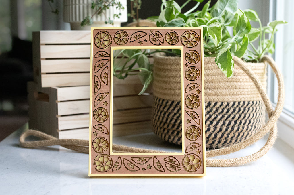 A 4x6 yellow lemon picture frame with laser cut lemons and the option for custom engraving to make a fruit lover gift.